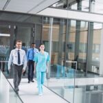 Doctors and nurse walking in corridor at hospital